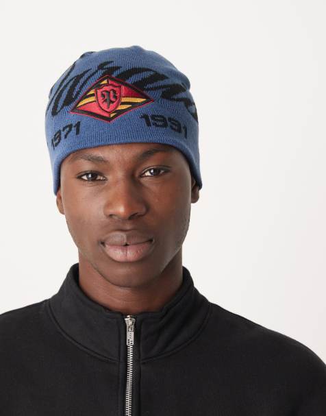 ASOS DESIGN knitted paraiso graphic skull beanie in navy - view 1