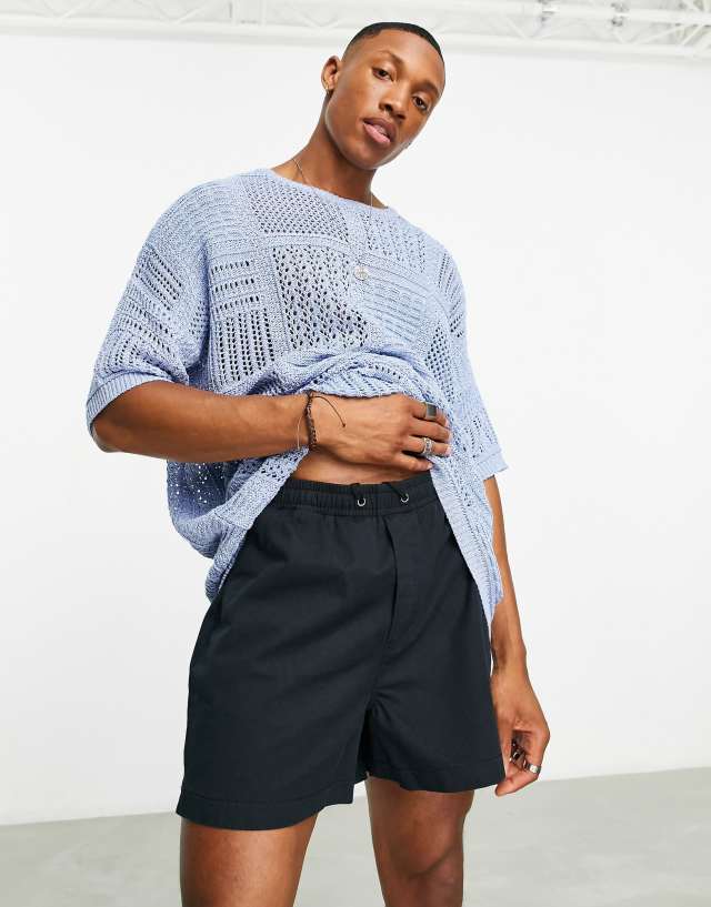 ASOS DESIGN knitted pointelle t-shirt with patchwork design in blue