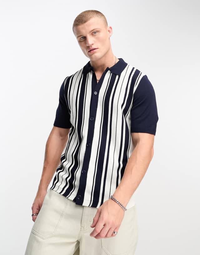 ASOS DESIGN knitted polo shirt with stripe in navy