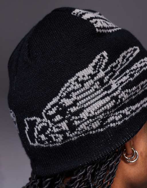 ASOS DESIGN knitted reversible skeleton graphic skull beanie in grey and black, 2 of 3