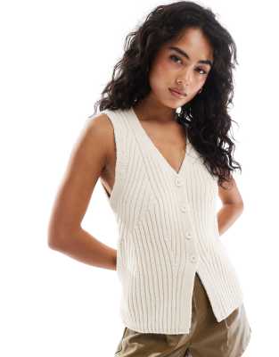 ASOS DESIGN knitted rib engineered longline waistcoat in cream