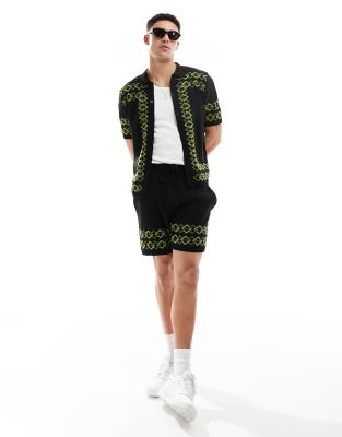 ASOS DESIGN knitted shorts in black with green border - part of a set