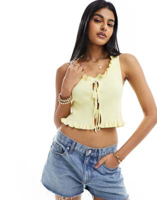 ASOS DESIGN knitted sleeveless lace up tank top in yellow