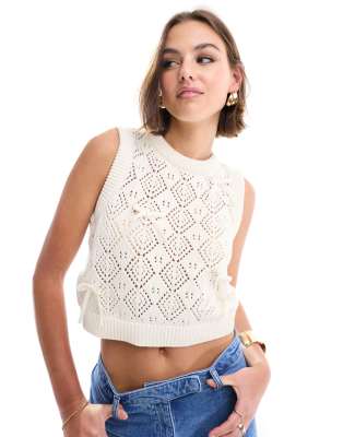 ASOS DESIGN knitted tank top in pointelle stitch with bow detail in cream-White