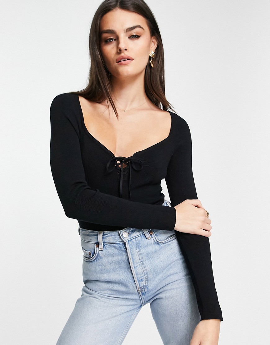 ASOS DESIGN knitted top with sweetheart neck and lace up front detail in black