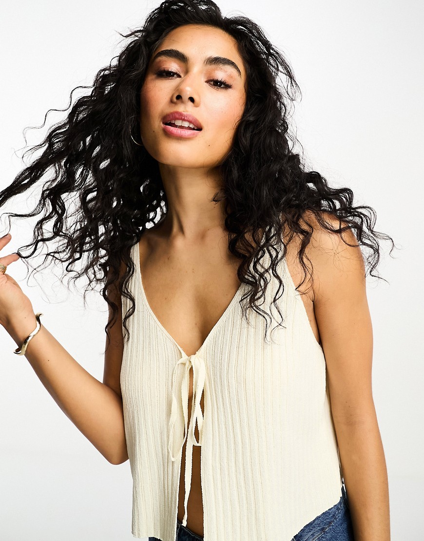 ASOS DESIGN knitted top with tie front in cream-White