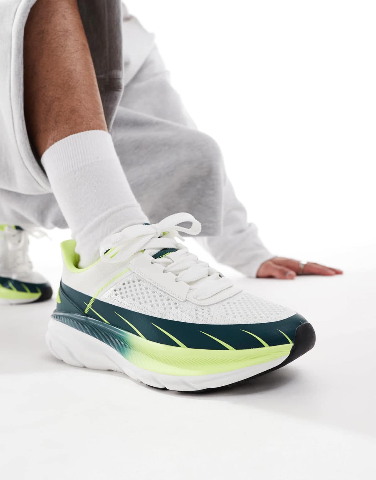 ASOS DESIGN knitted trainers in white with green panels
