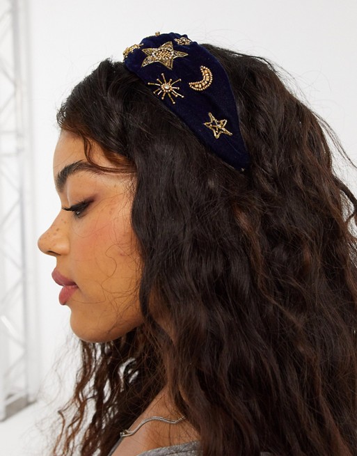 ASOS DESIGN knot headband with celestial embellishment in navy blue