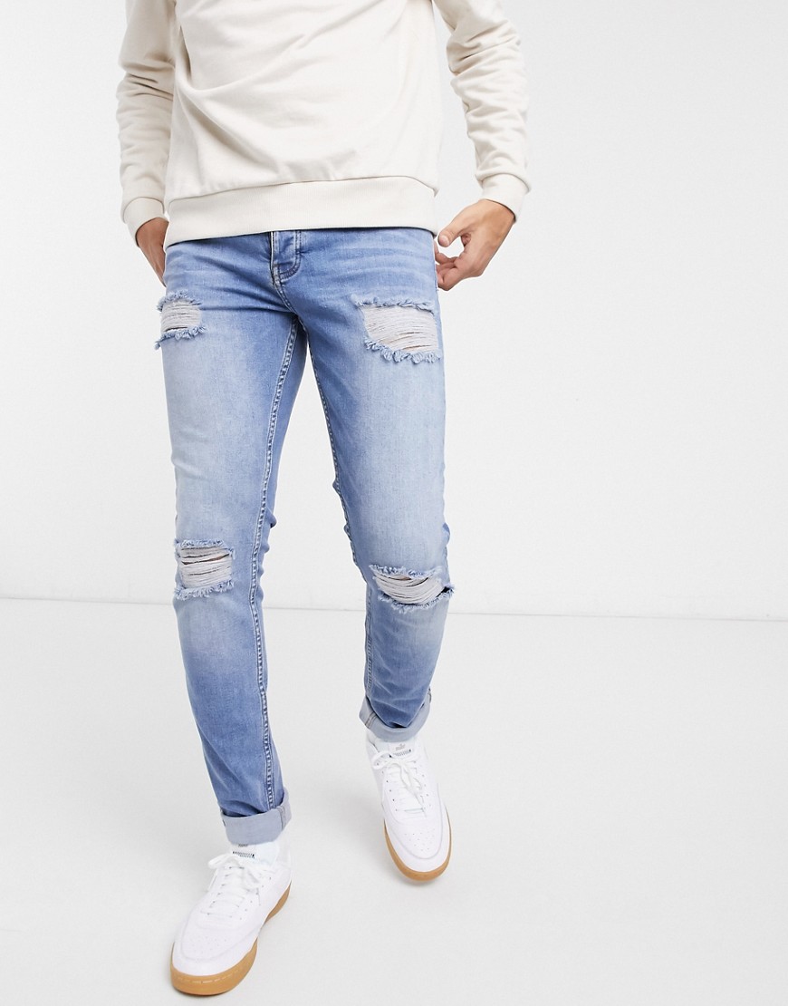 ASOS DESIGN - Økologiske skinny jeans i blå midwash med flænger på knæet