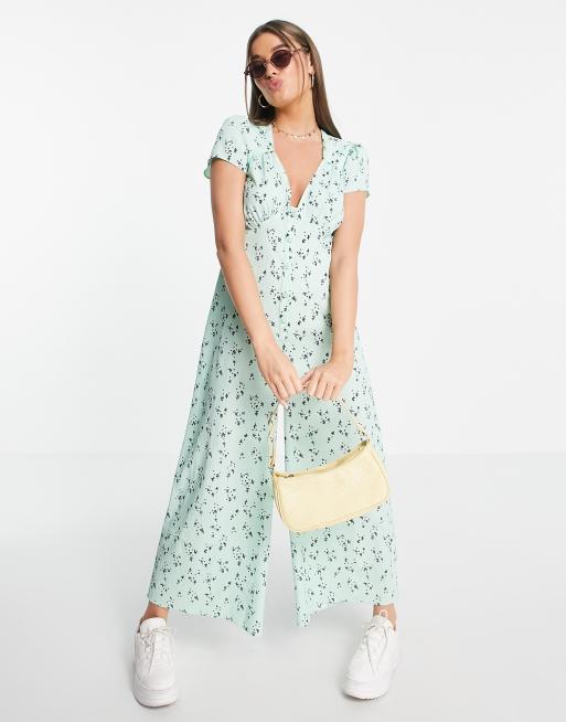 ASOS DESIGN – Kombinezon z zapięciem na guziki i krótkimi rękawami z gniecionego materiału w kolorze szałwiowym w drobny wzór