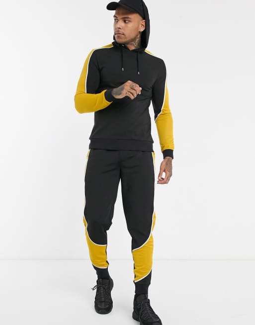 ASOS Design – Kombiteil mit Motorcross-Farbblockdesign in Schwarz & Gelb, 3 von 3