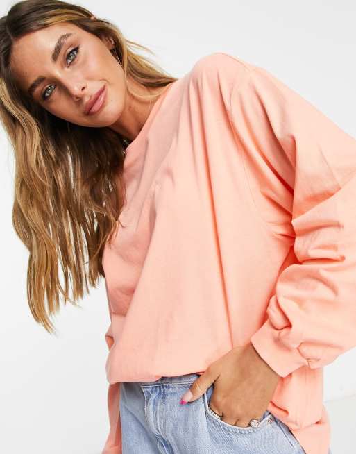 ASOS DESIGN - Koralfarvet oversized T-shirt med lange ærmer og tætsiddende ærmekanter