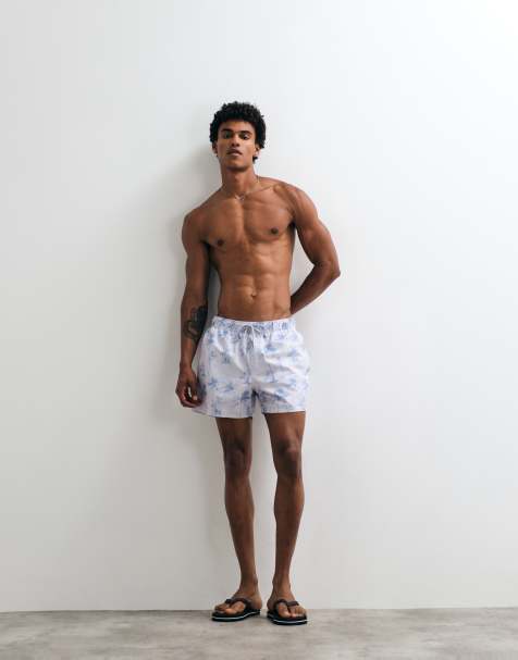 ASOS DESIGN - Korte zwemshort met palmboomprint in blauw met wassing - view 1
