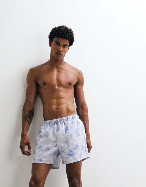 ASOS DESIGN - Korte zwemshort met palmboomprint in blauw met wassing, 2 van 5