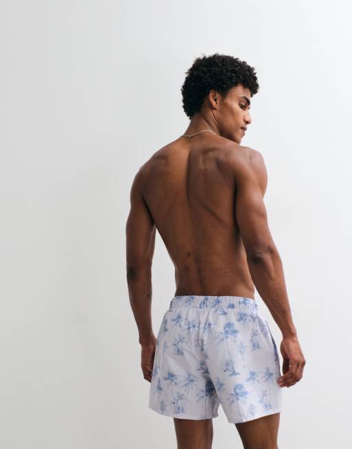 ASOS DESIGN - Korte zwemshort met palmboomprint in blauw met wassing, 3 van 5