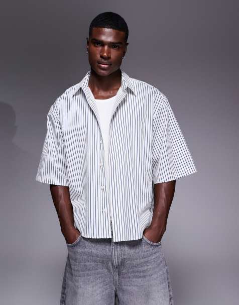 ASOS DESIGN boxy oversized shirt with dipped hem in blue pinstripe