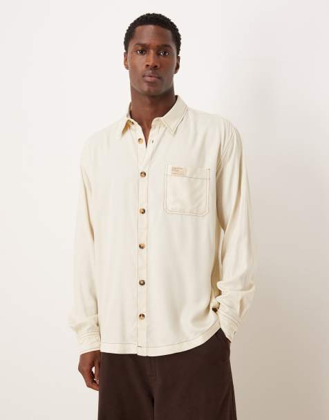 ASOS DESIGN relaxed shirt in cream with contrast stitching and badge detail