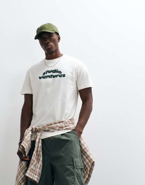 ASOS DESIGN – Kremowy T-shirt o regularnym kroju z grafiką Studio Ventures - view 1