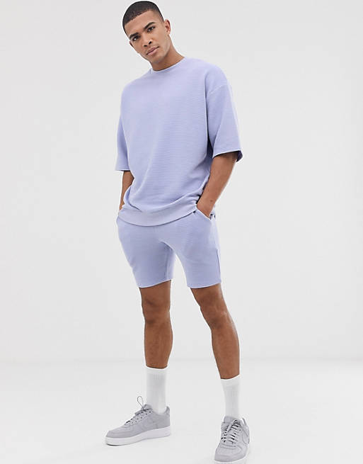 ASOS DESIGN – Kurzärmliger, lila Trainingsanzug mit Shorts aus geripptem Stoff