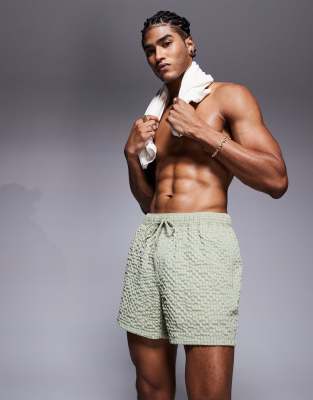 ASOS DESIGN – Kurze Badeshorts aus Seersucker in Grün - view 1