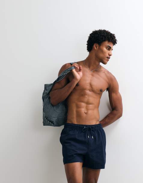 ASOS DESIGN – Kurze Badeshorts aus Seersucker in Marineblau - view 1