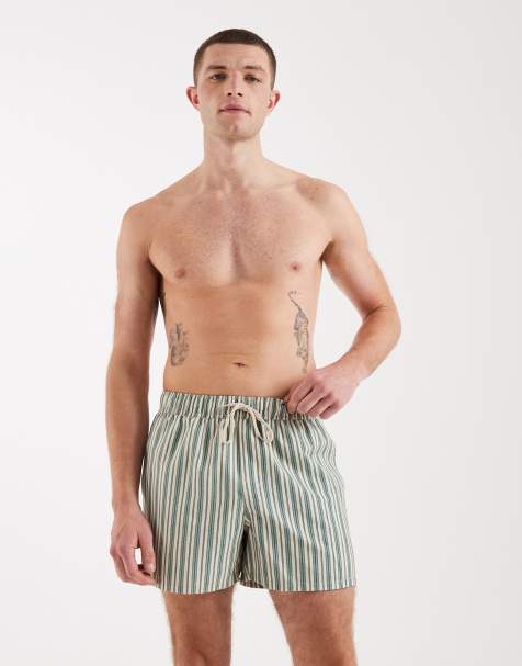 ASOS DESIGN – Kurze Badeshorts in Beige mit grünem Streifenmuster - view 1