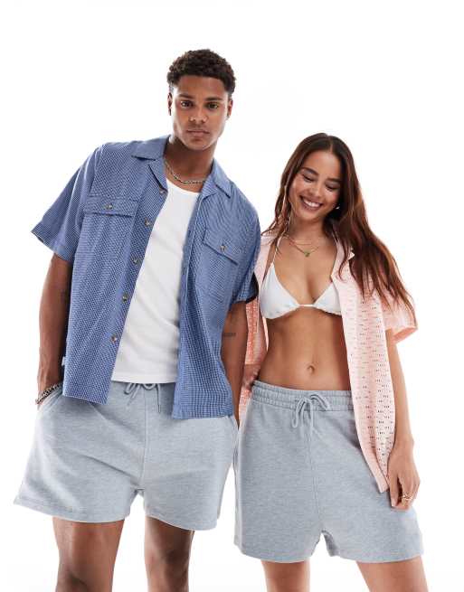 ASOS DESIGN – Kürzere, schmal geschnittene Unisex-Shorts in verwaschenem Blau