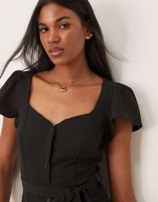 ASOS DESIGN – Kurzes Freizeitkleid in Schwarz mit Knopfleiste und Bindeband auf der Rückseite, 3 von 4