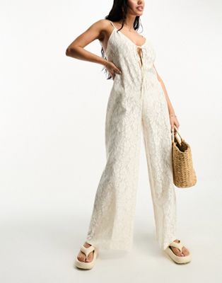ASOS DESIGN lace beach jumpsuit with cut out in cream - ASOS Price Checker