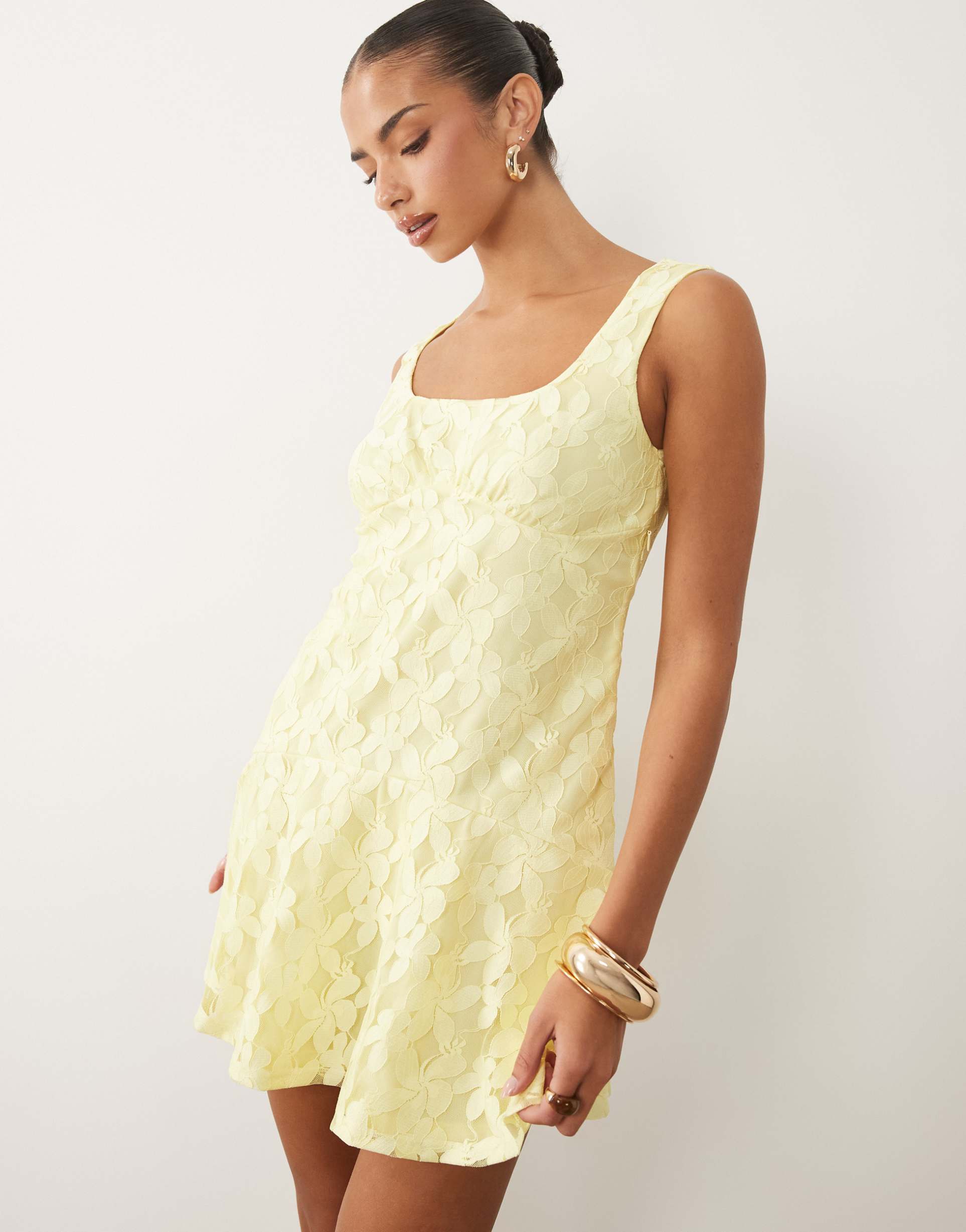 asos design lace mini dress with flippy hem in lemon