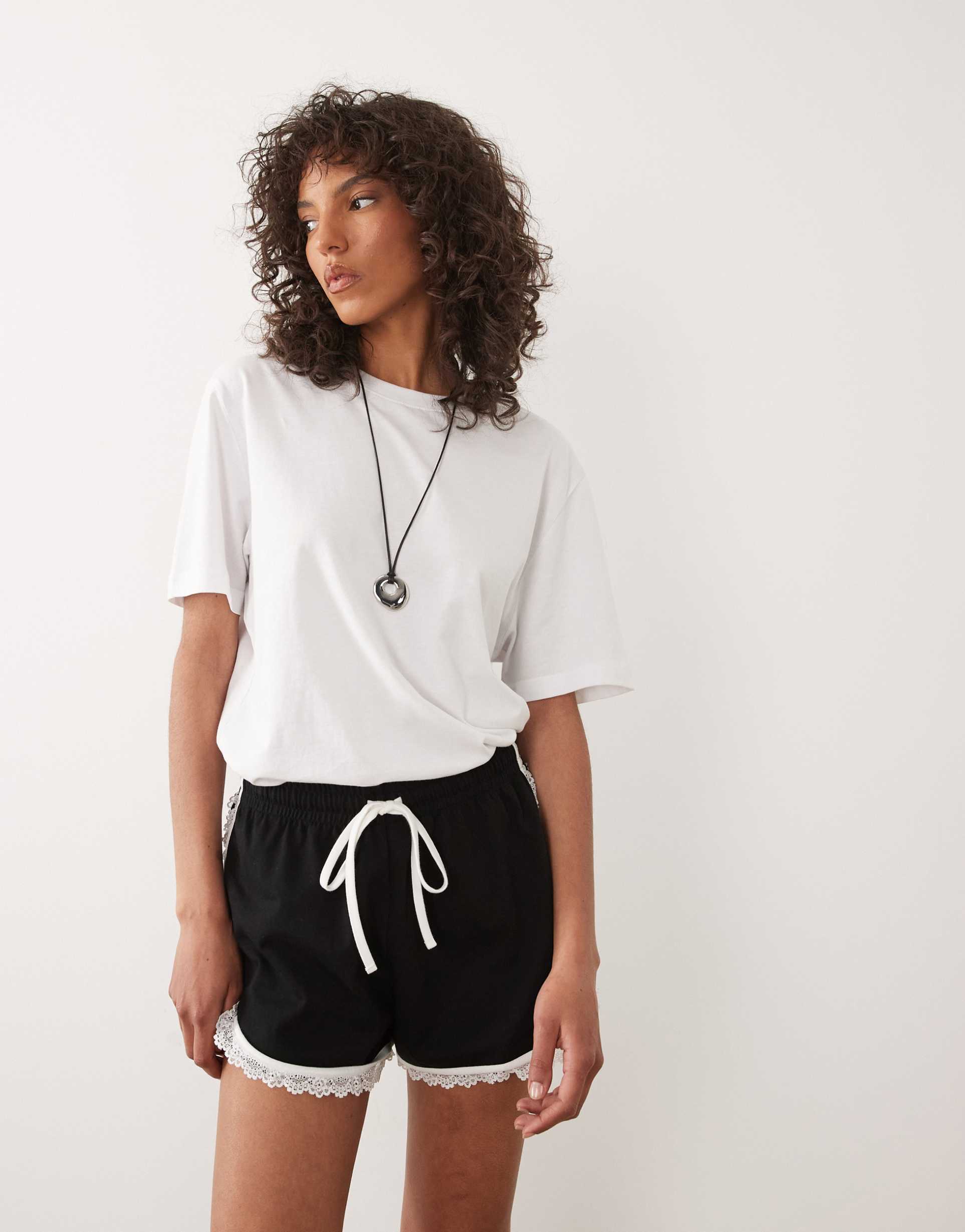 asos design lace runner shorts in black