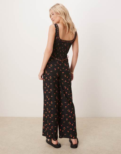 ASOS DESIGN lace trim button through wide leg spun jumpsuit in black cherry print
