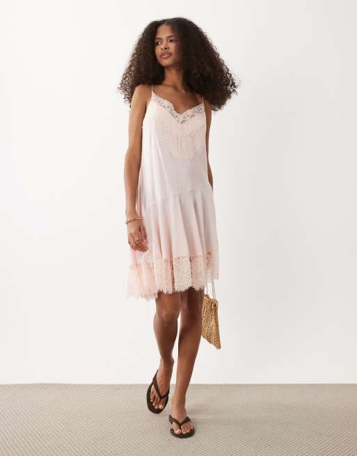 ASOS Design lace trim mini slip dress with asymmetric hem in pale pink