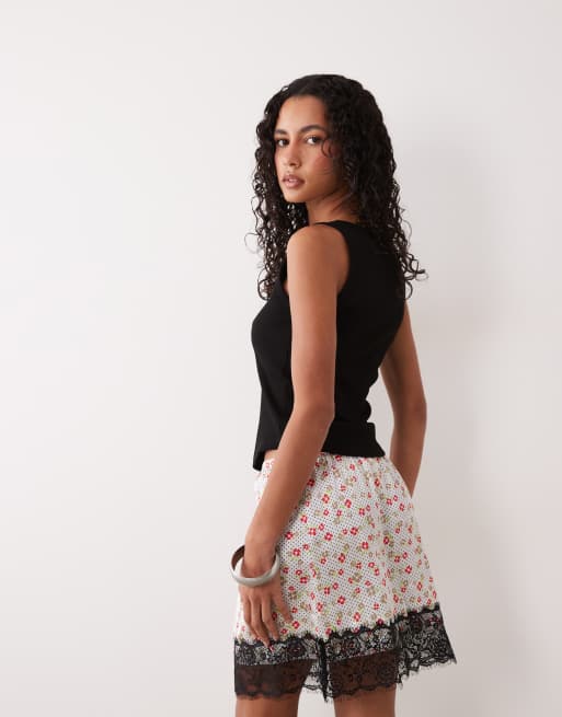 ASOS DESIGN lace trim satin mini skirt in white ditsy print, 4 of 5