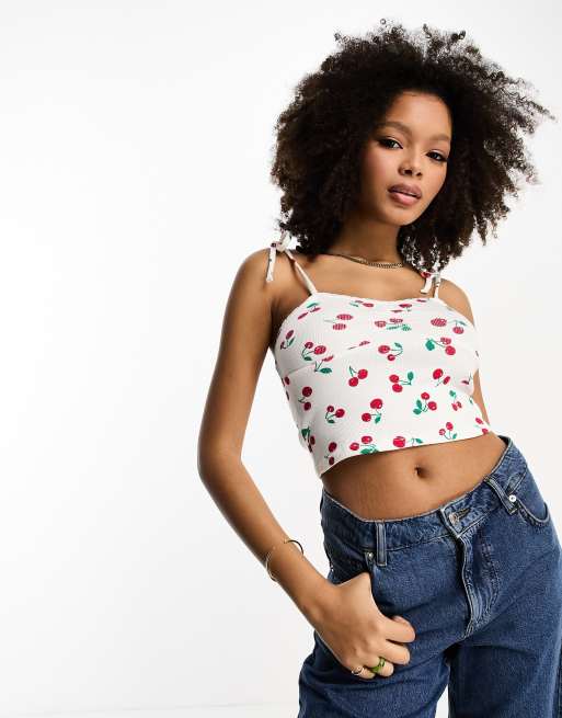 ASOS DESIGN lace trim tie strap top in white based cherry print