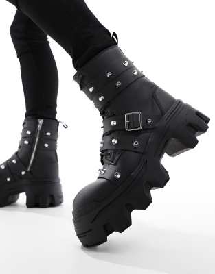  lace up boot with chunky sole and studded strapping  faux leather