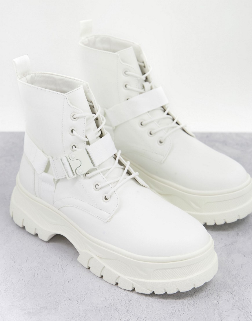 ASOS DESIGN lace up boots in white faux leather with strap detail on chunky sole