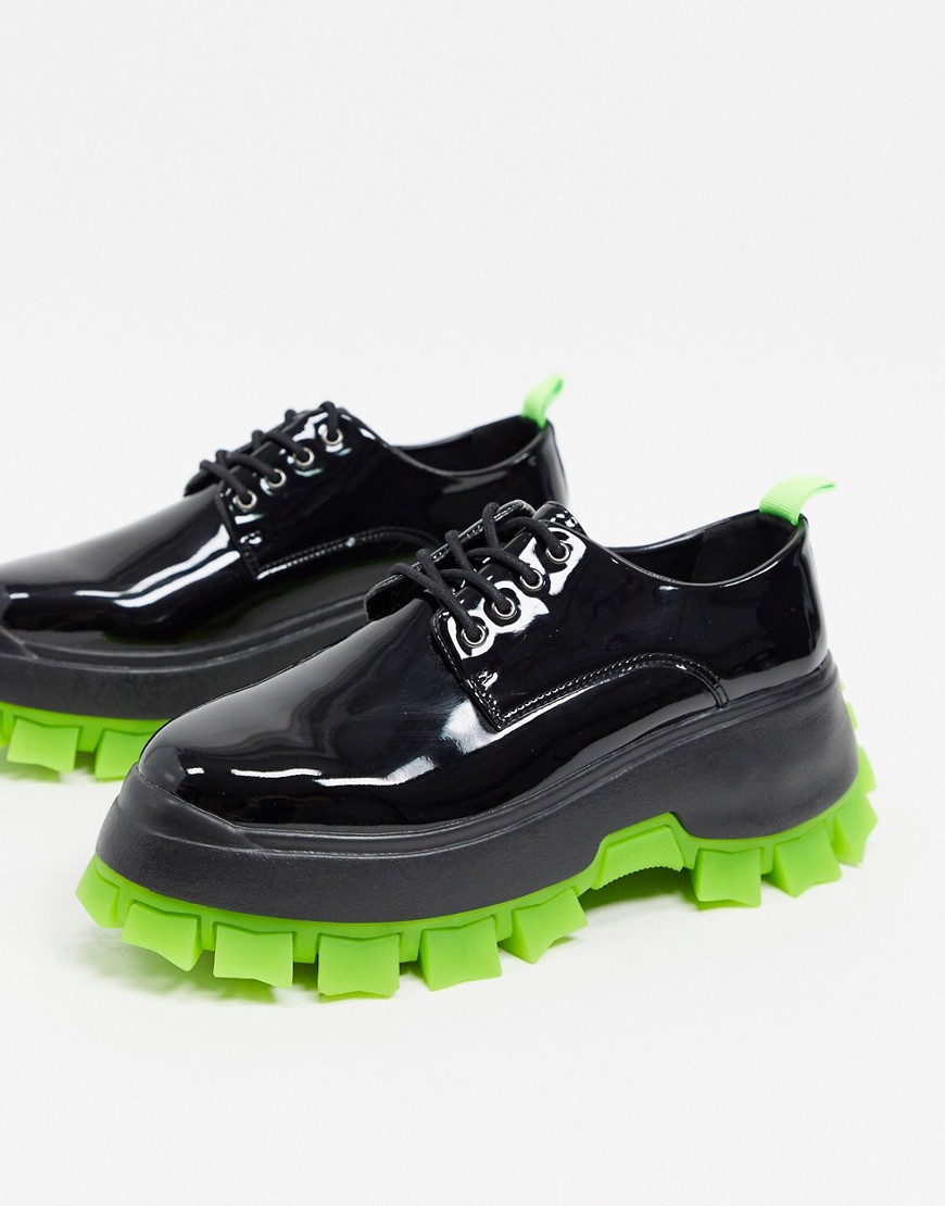 ASOS DESIGN lace up shoes in black faux leather with green cleated sole