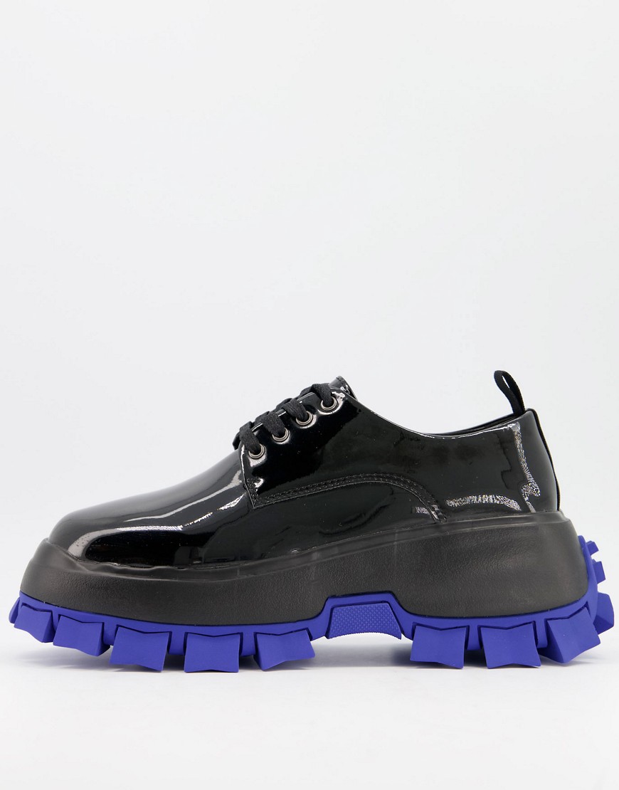 ASOS DESIGN lace up shoes in black patent with chunky cleated blue sole