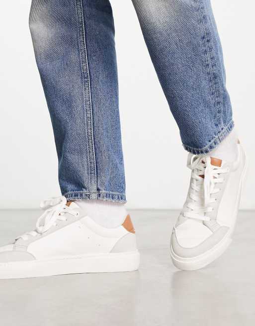 ASOS DESIGN lace-up sneakers in white with embossed monogram