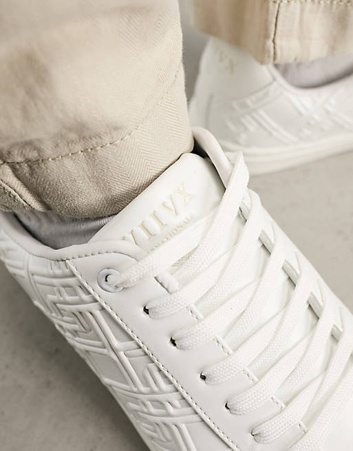 ASOS DESIGN lace-up sneakers in white with embossed monogram