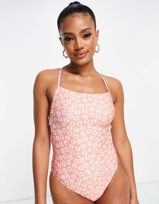 ASOS DESIGN lace up strappy swimsuit in mixed ditsy floral print