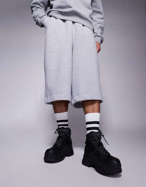 ASOS DESIGN lace up worker boots in black with chunky sole and straps