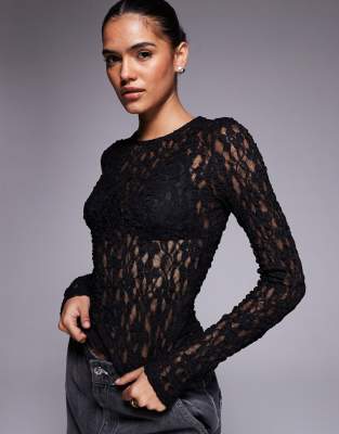 ASOS DESIGN - Langärmliges Oberteil aus transparenter Spitze in Schwarz mit Rundhalsausschnitt