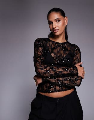 ASOS DESIGN - Langärmliges Oberteil aus transparenter Spitze in Schwarz mit verstreuter Paillettenverzierung