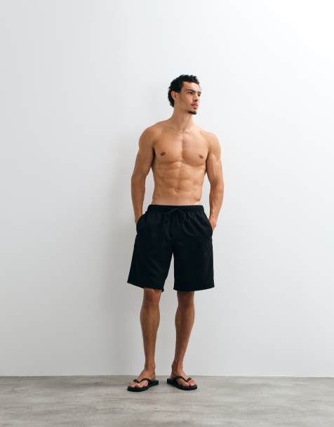 ASOS DESIGN – Lange Badeshorts in Schwarz - view 1