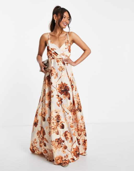 ASOS DESIGN - Lange jurk met diep decolleté, camibandjes en strik achter in bloemenprint