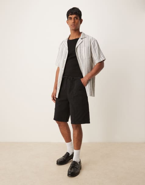 ASOS DESIGN – Lange Schlupf-Cargo-Jorts in Schwarz - view 1