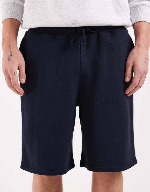 ASOS DESIGN – Länger geschnittene Oversize-Bermudashorts aus Jersey in Marineblau mit Paspelierung, 4 von 5