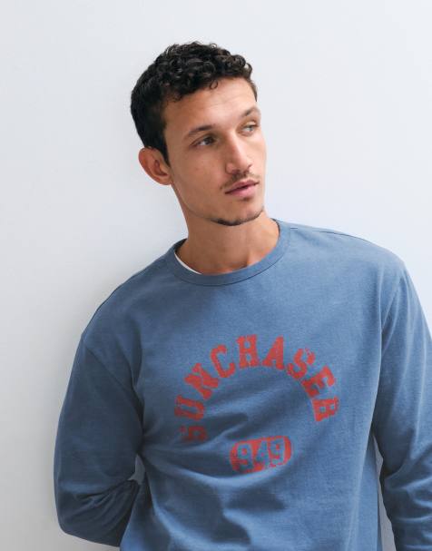ASOS DESIGN langærmet T-shirt med afslappet pasform og sun chaser-grafik i navy vask - view 1